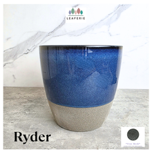 Load image into Gallery viewer, Ryder Blue and beige ceramic planter with 'Leaferie' branding on a marble background
