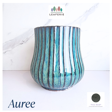 The Leaferie Auree blue ceramic pot.