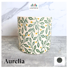 Load image into Gallery viewer, Aurelia Decorative pot with leaf pattern on a marble surface, featuring the brand 'LEAFAERIE'.
