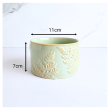 Load image into Gallery viewer, Mirela Decorative ceramic pot with leaf patterns on a white background, featuring the brand &#39;LEAFERIE&#39;.
