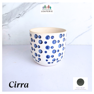 Cirra White ceramic planter with blue dot pattern on a light gray background, featuring the brand 'LEAFAERIE'.