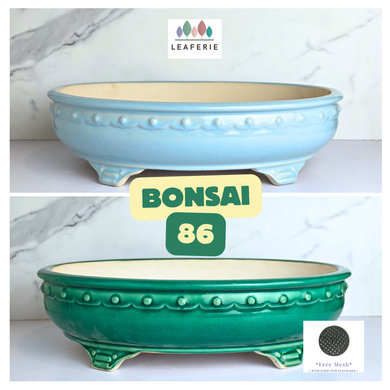 Bonsai series 86 . 2 ceramic bonsai pots in blue and green on a white background with 'LEAFERIE' branding.