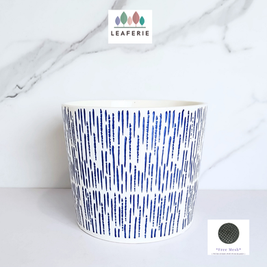 The Leaferie Marin blue and white ceramic pot.