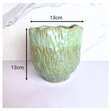 Load image into Gallery viewer, Lime Green ceramic vase with gold accents on a white background, featuring the Leaferie brand.
