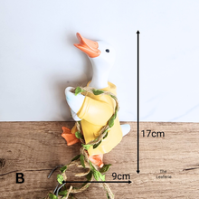 Load image into Gallery viewer, Pip Hanging Decoration .Two decorative items, a yellow mouse and a yellow duck, on a swing with &#39;LEAFERIE&#39; branding.
