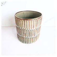 Load image into Gallery viewer, Elira Ceramic pot with ribbed texture on a white background, featuring the Leaferie brand.
