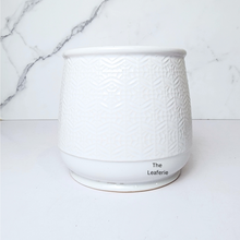 Load image into Gallery viewer, The Leaferie Nordman white ceramic pot with small imprinted design.
