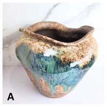 Load image into Gallery viewer, Raku ceramic vase with gold and blue glaze on a white background, featuring the Leaferie brand.
