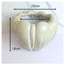 Load image into Gallery viewer, Evara Heart-shaped ceramic flowerpot with textured brand 'LEAFERIE'.
