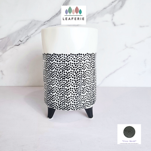 The Leaferie dottie black polka dot ceramic tall flowerpot.