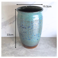 Load image into Gallery viewer, Aster Tall Decorative pot with speckled pattern on a marble surface, branded 'LEAFERIE'.
