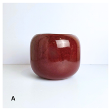 Load image into Gallery viewer, Soraya ceramic pots, one red and one green, with &#39;LEAFERIE&#39; branding on a white background.
