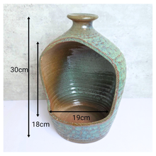 Load image into Gallery viewer, Lumo Ceramic vase with textured surface and &#39;LEAFERIE&#39; branding on a light gray background
