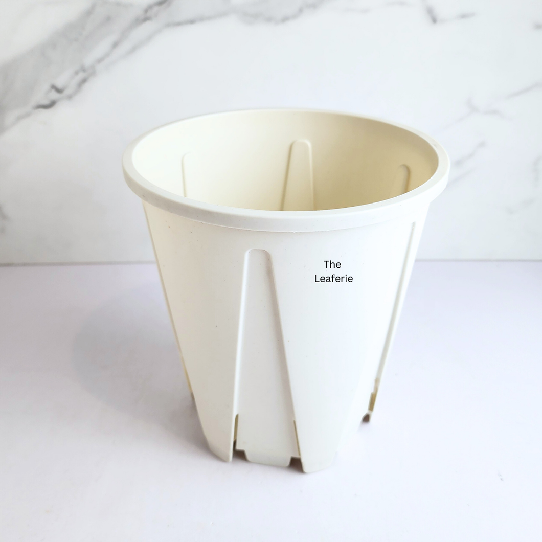 White plastic planter with a matching saucer , featuring the LEAFERIE brand.