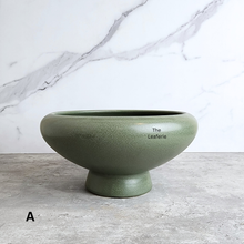 Load image into Gallery viewer, Xara ceramic flowerpot in white, black, and green with Leaferie branding.
