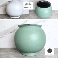 Load image into Gallery viewer, The Leaferie Aalto round green and white ceramic flowerpot. 
