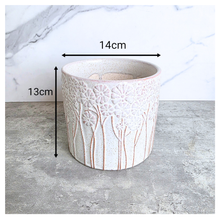Load image into Gallery viewer, Meliora Ceramic planter with floral patterns on a gray surface, branded 'Meliora' and 'Leaferie'.
