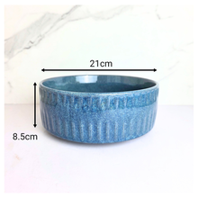 Load image into Gallery viewer, Bloom Blue ceramic bowl with textured surface on a white background, featuring the LEAFAERIE brand.
