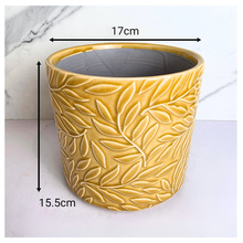 Load image into Gallery viewer, Marigold Yellow ceramic pot with leaf pattern on a marble background, featuring the Leaferie brand.
