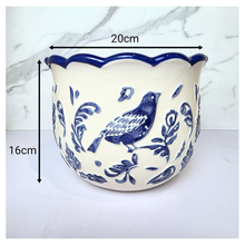 Load image into Gallery viewer, Camari Ceramic planter with blue bird and floral patterns on a white background, featuring the brand &#39;LEAFERIE&#39;.
