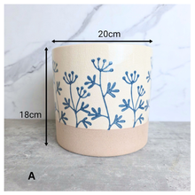 Load image into Gallery viewer, Evie floralCylindrical fabric basket with blue floral patterns on a light background, featuring the brand 'LEAFERIE'.
