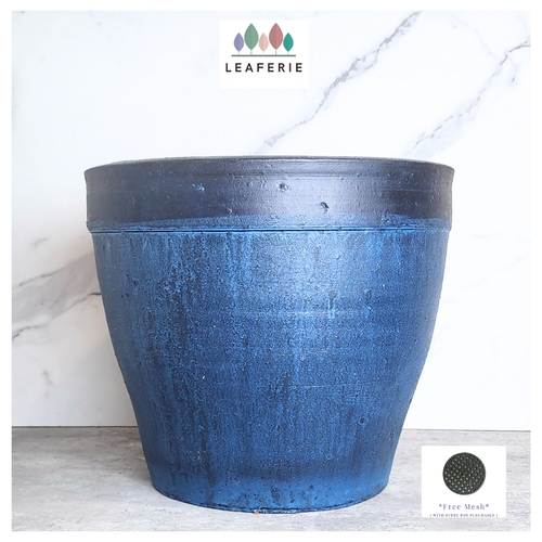 Blue planter with 'Leaferie' branding on a marble background