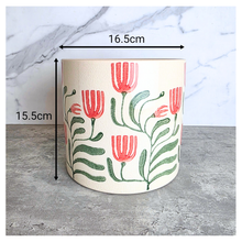 Load image into Gallery viewer, Emmett Decorative pot with floral design on a marble surface, featuring the brand 'LEAVERIE'.
