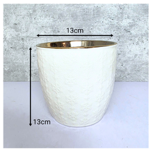 Load image into Gallery viewer, Yule snowflakes White textured planter with gold interior on a light gray background, featuring the Leaferie brand.
