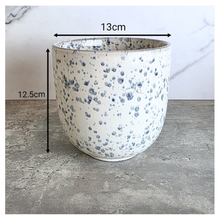 Load image into Gallery viewer, Benton Speckled patterned planter on a concrete surface with 'LEAFERIE' branding.
