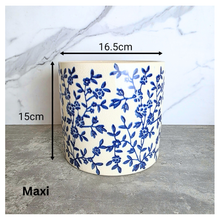 Load image into Gallery viewer, Caelis Ceramic planter with blue floral pattern on a marble surface, featuring the brand 'LEAFAERIE'.
