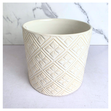 Load image into Gallery viewer, Elaris White textured ceramic planter on a marble background with 'LEAFAERIE' branding.
