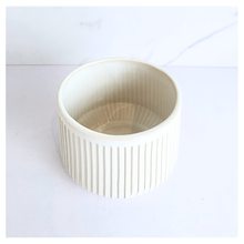Load image into Gallery viewer, Oraya Leaferie White ribbed planter on a light gray background with Leaferie branding.

