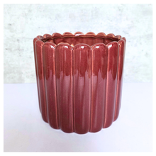Load image into Gallery viewer, Rubi Red ceramic vase with ribbed texture on a light gray background, featuring the brand 'LEAFERIE'.
