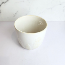 Load image into Gallery viewer, The Leaferie Izan ceramic white pot.
