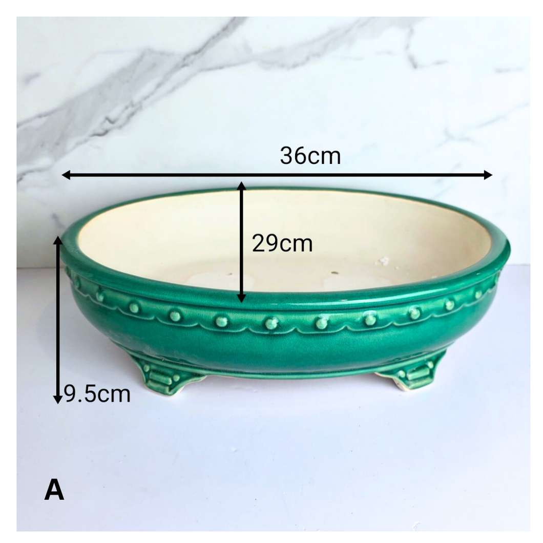 Bonsai series 86 . 2 ceramic bonsai pots in blue and green on a white background with 'LEAFERIE' branding.