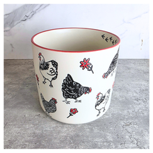 Load image into Gallery viewer, Nilo Ceramic pot with chicken design on a marble background, featuring the brand 'LEAFERIE'.
