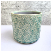 Load image into Gallery viewer, Rosso Green ceramic pot with geometric pattern on a light gray background, featuring the Leaferie brand.
