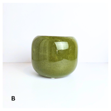 Load image into Gallery viewer, Soraya ceramic pots, one red and one green, with &#39;LEAFERIE&#39; branding on a white background.
