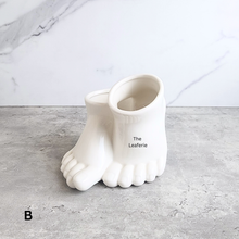 Load image into Gallery viewer, The Leaferie Stomy foot black and white ceramic pot. 
