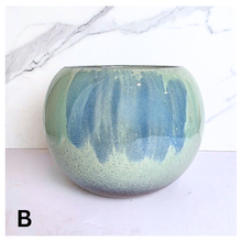 Load image into Gallery viewer, Ares Two green ceramic pots on a white marble surface with 'LEAFAERIE' branding.
