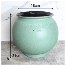 Load image into Gallery viewer, The Leaferie Aalto round green and white ceramic flowerpot. 
