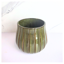 Load image into Gallery viewer, Zyra Green ceramic vase with striped pattern on a white background, featuring the brand &#39;LEAFERIE&#39;.
