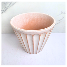 Load image into Gallery viewer, Yuno terracotta planter with ribbed design on a marble background, featuring the brand 'LEAFERIE'.
