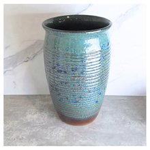 Load image into Gallery viewer, Aster Tall Decorative pot with speckled pattern on a marble surface, branded 'LEAFERIE'.
