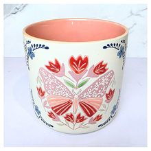 Load image into Gallery viewer, Bloomie Ceramic pot with floral and butterfly design on a marble background, featuring the brand &#39;LEAFERIE&#39;.
