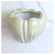 Load image into Gallery viewer, Evara Heart-shaped ceramic flowerpot with textured brand 'LEAFERIE'.
