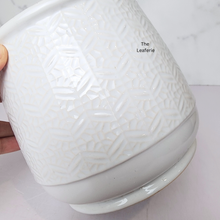 Load image into Gallery viewer, The Leaferie Nordman white ceramic pot with small imprinted design.
