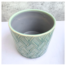 Load image into Gallery viewer, Rosso Green ceramic pot with geometric pattern on a light gray background, featuring the Leaferie brand.
