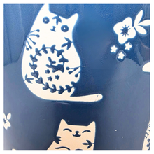 Load image into Gallery viewer, Niko cat Navy blue mug with white cat designs on a white background, featuring the brand &#39;LEAFERIE&#39;.
