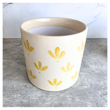 Load image into Gallery viewer, Romy Two ceramic planters with yellow patterns on a gray surface, branded 'LEAFERIE'.

